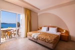 Кровать или кровати в номере Alexandros Palace