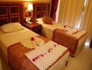 Кровать или кровати в номере Grand Nar Hotel