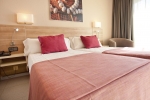 Кровать или кровати в номере Port Eugeni