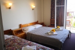 Кровать или кровати в номере Taradella Hotel