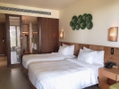 Кровать или кровати в номере Dusit Princess Moonrise Beach Resort