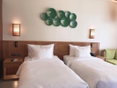 Кровать или кровати в номере Dusit Princess Moonrise Beach Resort