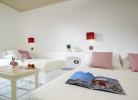 Кровать или кровати в номере Aldemar Cretan Village