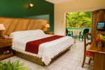 Кровать или кровати в номере Legends Beach Resort