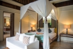 Кровать или кровати в номере Komaneka at Bisma Ubud