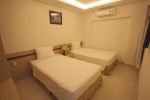 Кровать или кровати в номере Melody Hotel