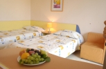 Кровать или кровати в номере Hotel Com - All Inclusive