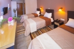 Кровать или кровати в номере Kyparissia Beach Hotel