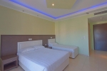 Кровать или кровати в номере Grand Platon Hotel