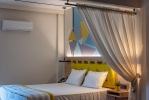 Кровать или кровати в номере Mythic Summer Hotel