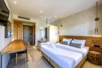 Кровать или кровати в номере Stella Village Hotel & Bungalows