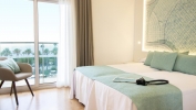 Кровать или кровати в номере Golden Taurus Aquapark Resort
