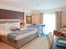 Кровать или кровати в номере Paloma Pasha Resort - Luxury Hotel