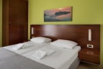 Кровать или кровати в номере Oscar Suites & Village