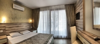 Кровать или кровати в номере Omer Holiday Resort - All Inclusive