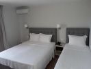 Кровать или кровати в номере Atlantis Hotel