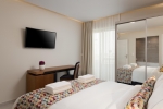 Кровать или кровати в номере Bio Suites Hotel