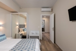 Кровать или кровати в номере Bio Suites Hotel