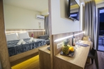 Кровать или кровати в номере Hotel Yakinthos