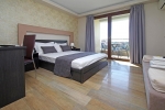 Кровать или кровати в номере Principal New Leisure Hotel