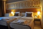 Кровать или кровати в номере Kemer Botanik Resort Hotel