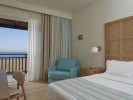 Кровать или кровати в номере Pilot Beach Resort
