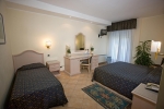 Кровать или кровати в номере Sant Alphio Garden Hotel & SPA