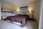 Кровать или кровати в номере Messonghi Beach Holiday Resort
