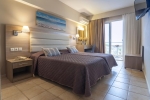 Кровать или кровати в номере Messonghi Beach Holiday Resort