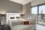 Кровать или кровати в номере Wyndham Dubai Marina