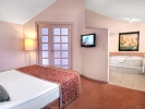 Кровать или кровати в номере Starlight Resort Hotel - Kids Concept