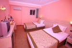 Кровать или кровати в номере Side Town Hotel