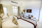 Кровать или кровати в номере Barry Boutique Hotel Sanya