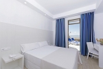 Кровать или кровати в номере HSM Hotel President