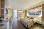 Кровать или кровати в номере Crystal Sunset Luxury Resort & Spa - Ultra All Inclusive