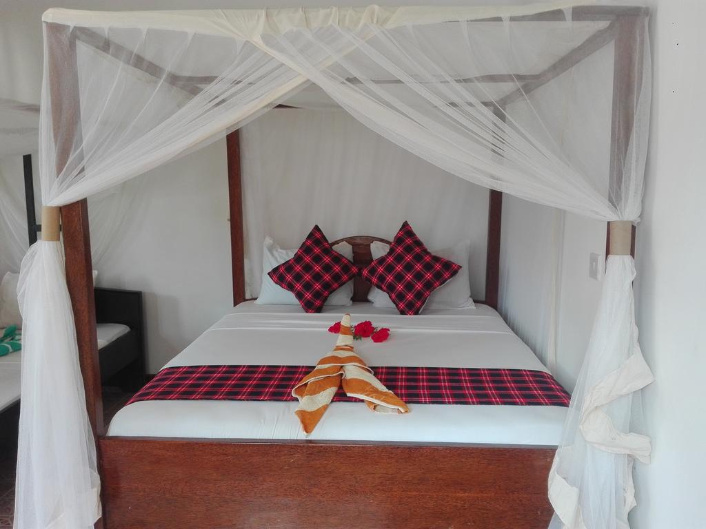 Отель Кровать или кровати в номере Kihori Bungalows