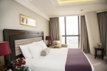 Кровать или кровати в номере Bab Al Qasr Hotel