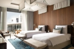 Кровать или кровати в номере Jumeirah at Saadiyat Island Resort