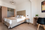 Кровать или кровати в номере Hotel Las Arenas