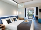 Кровать или кровати в номере Blue Dolphin Hotel