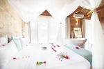 Кровать или кровати в номере Tulia Zanzibar Unique Beach Resort