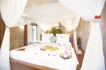 Кровать или кровати в номере Tulia Zanzibar Unique Beach Resort