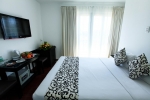 Кровать или кровати в номере Paragon Villa Hotel