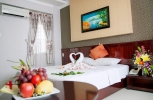 Кровать или кровати в номере Victorian Nha Trang Hotel
