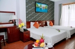 Кровать или кровати в номере Victorian Nha Trang Hotel