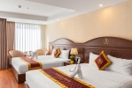 Кровать или кровати в номере Regalia Nha Trang