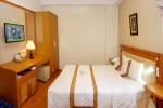 Кровать или кровати в номере Dendro Hotel