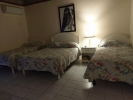 Кровать или кровати в номере Shields Negril Villas LTD