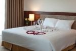 Кровать или кровати в номере Muong Thanh Grand Nha Trang Hotel