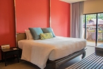 Кровать или кровати в номере Impiana Resort Chaweng Noi, Koh Samui